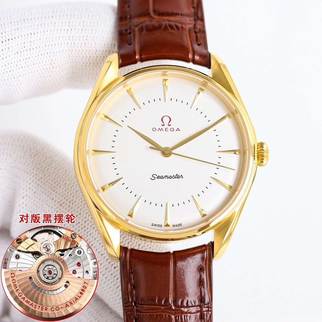 Gold Seamaster wristwatch with white dial and brown leather strap, round case