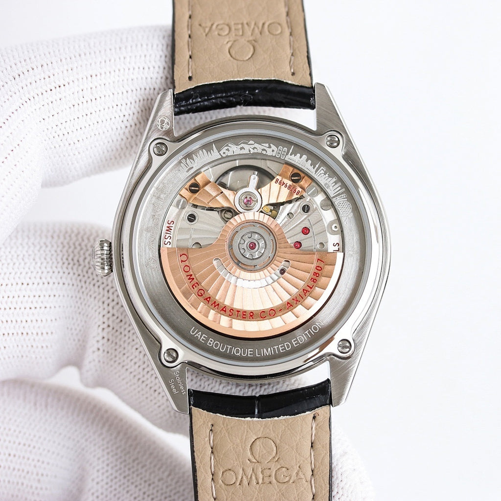 Seamaster watch caseback in silver with visible movement, beige leather strap