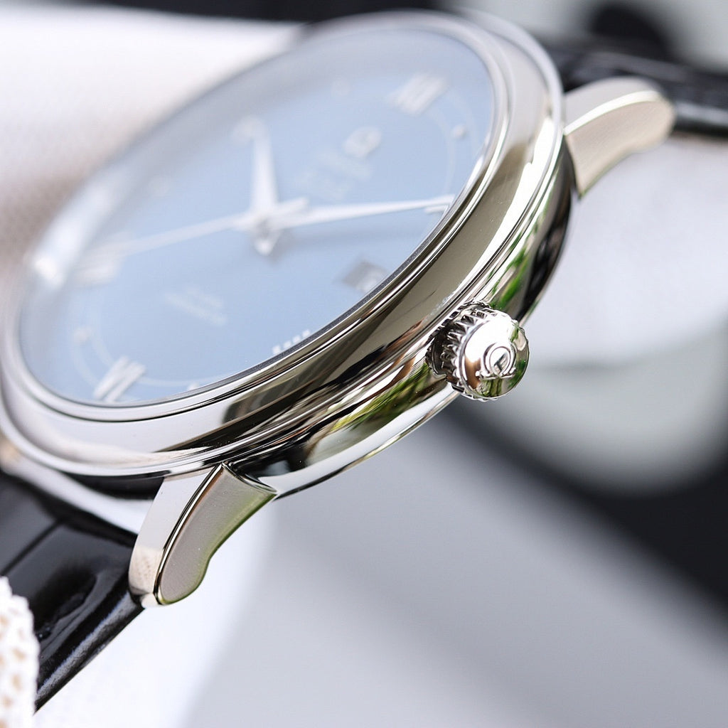 Omega watch with blue dial, silver case, crown detail, black leather strap