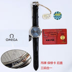 Omega watch with black leather strap and silver case, hanging display tag