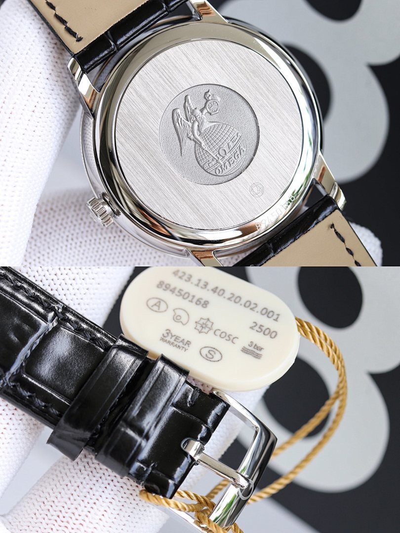 Omega watch caseback with engraved emblem, black leather strap and tang buckle