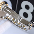 Omega wristwatch bracelet with engraved clasp and silver-and-gold metal links