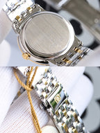 Omega wristwatch case back with brushed metal finish and linked silver bracelet