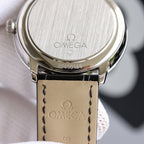 Wristwatch caseback with brushed metal finish and engraved markings
