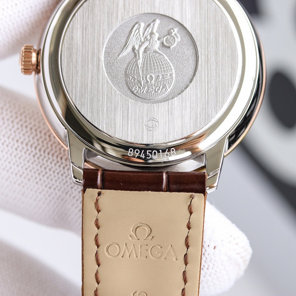 Wristwatch case back with engraved emblem and brown leather strap