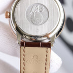 Wristwatch case back with engraved emblem and brown leather strap