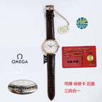 Omega watch on brown leather strap with round white dial and buckle clasp