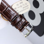 Omega watch brown leather strap with stitched pattern and silver-tone buckle clasp