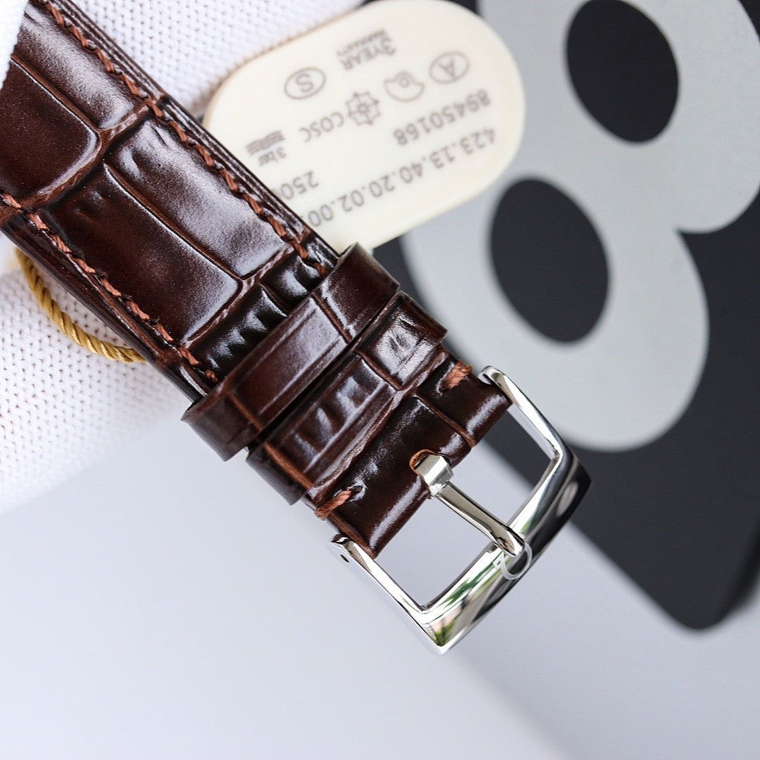 Omega watch brown leather strap with stitched pattern and silver-tone buckle clasp