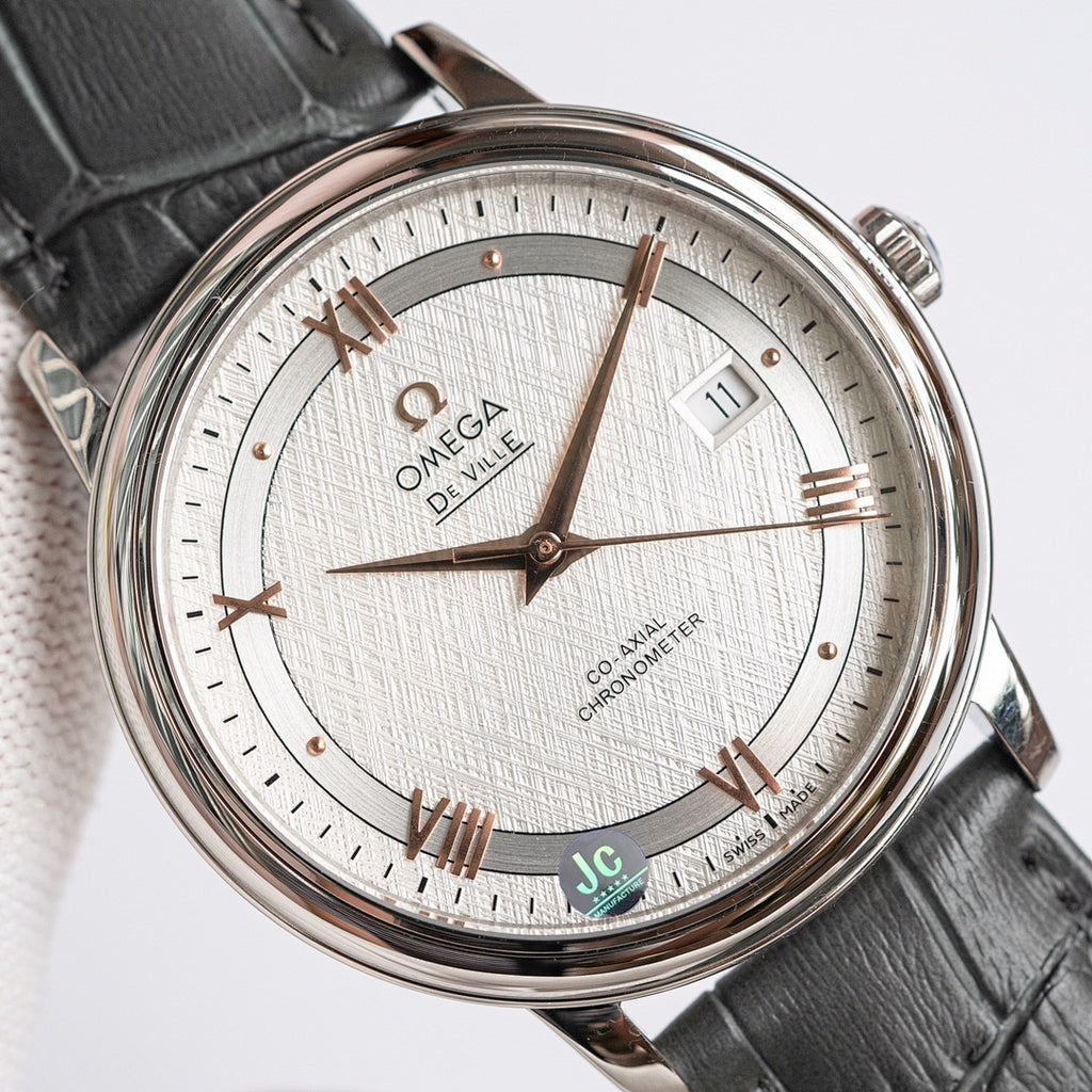 Omega wristwatch with textured white dial, rose-gold accents, date window at 3