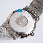 Omega watch case back with engraved medallion and metal bracelet