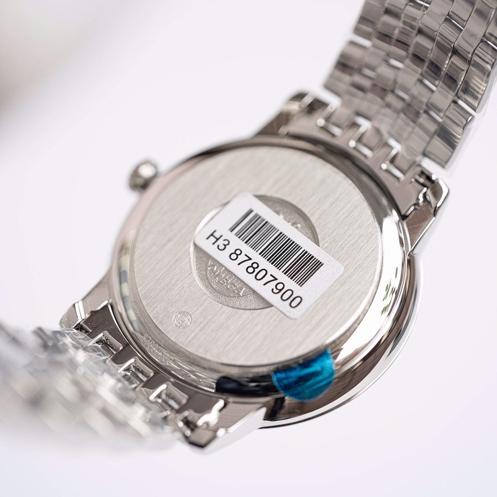 Omega De Ville case back with barcode label and engraved serial numbers