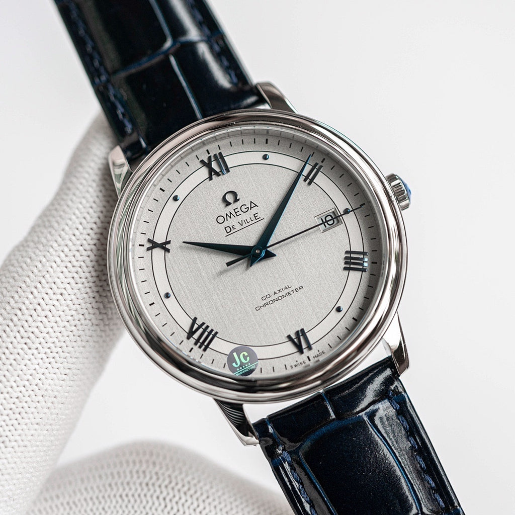 Omega De Ville wristwatch with blue leather strap and silver dial, Roman numerals