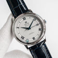 Omega De Ville wristwatch with blue leather strap and silver dial, Roman numerals