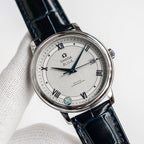 Omega De Ville wristwatch with blue leather strap and silver dial, Roman numerals