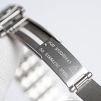 Omega De Ville stainless steel case back with engraved model and stainless steel text