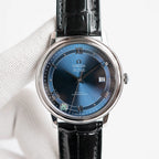 Omega De Ville wristwatch with black leather strap and blue dial, silver case and 12 date window