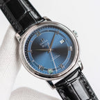 Omega De Ville wristwatch with black leather strap and blue dial, silver case and crown