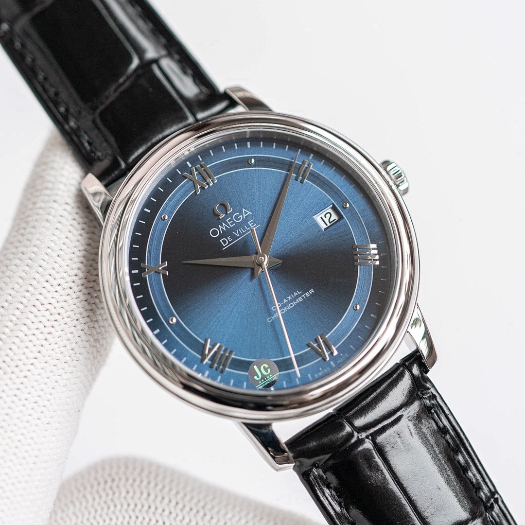 Omega De Ville wristwatch with black leather strap and blue dial, silver case and crown