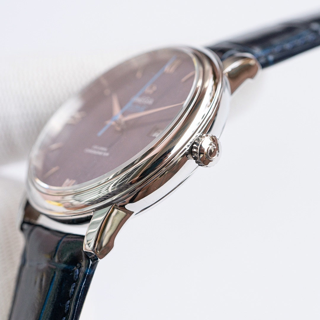 Omega watch side view with crown and blue dial, stainless steel case