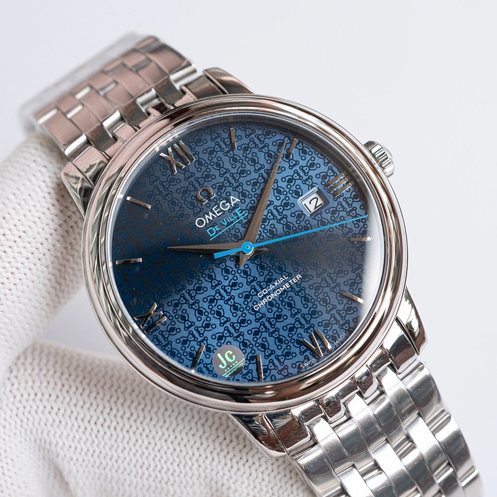 Omega watch with blue patterned dial and silver metal bracelet, roman numerals