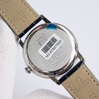 Omega watch case back with markings and barcode on dark blue leather strap
