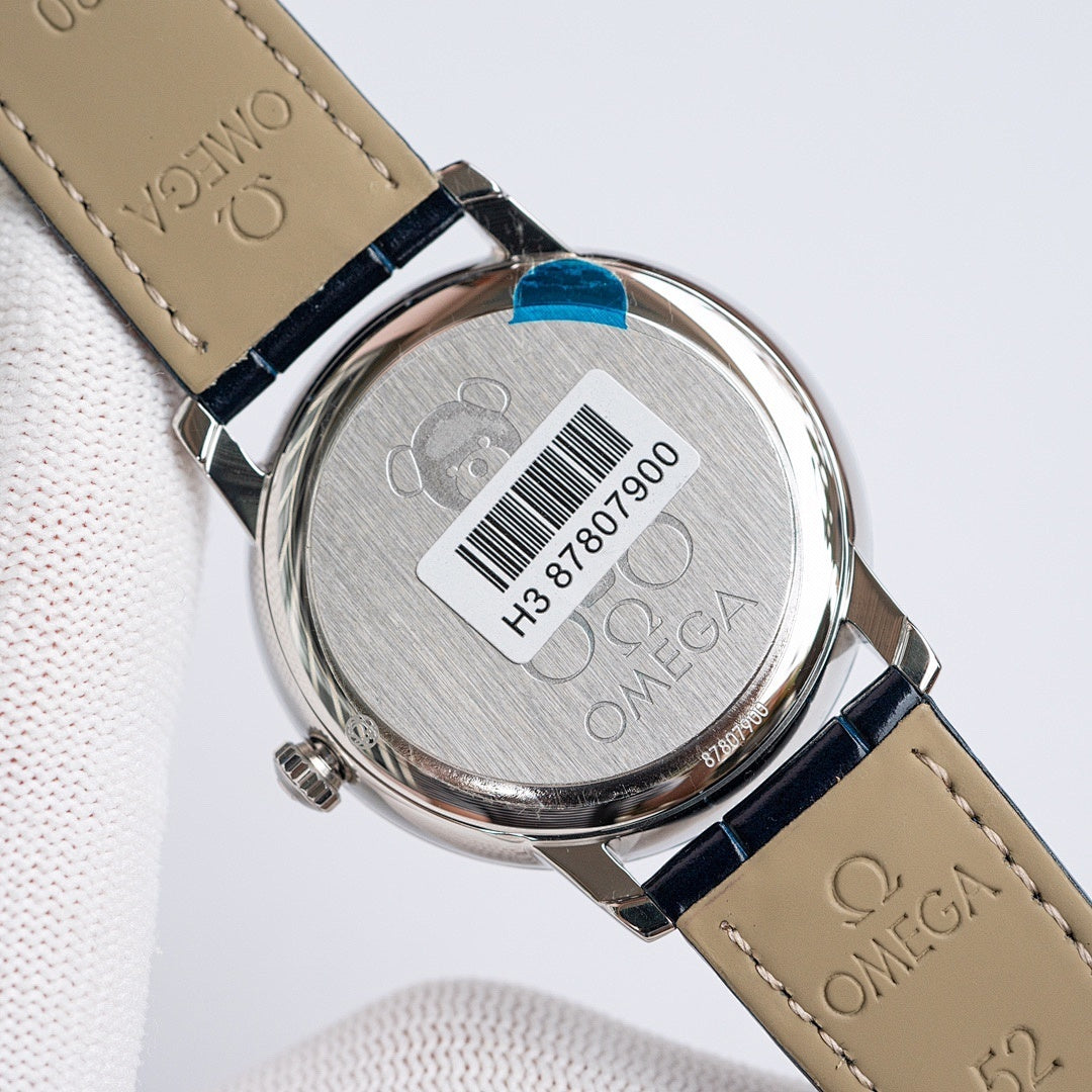 Omega watch case back with markings and barcode on dark blue leather strap