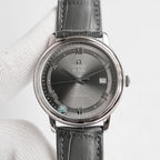 Omega De Ville wristwatch with black leather strap, dark dial, date 26.