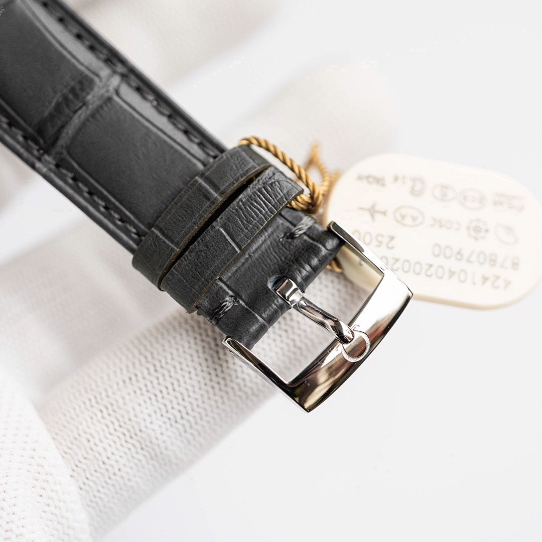 Omega De Ville watch case back with leather strap and metal buckle.