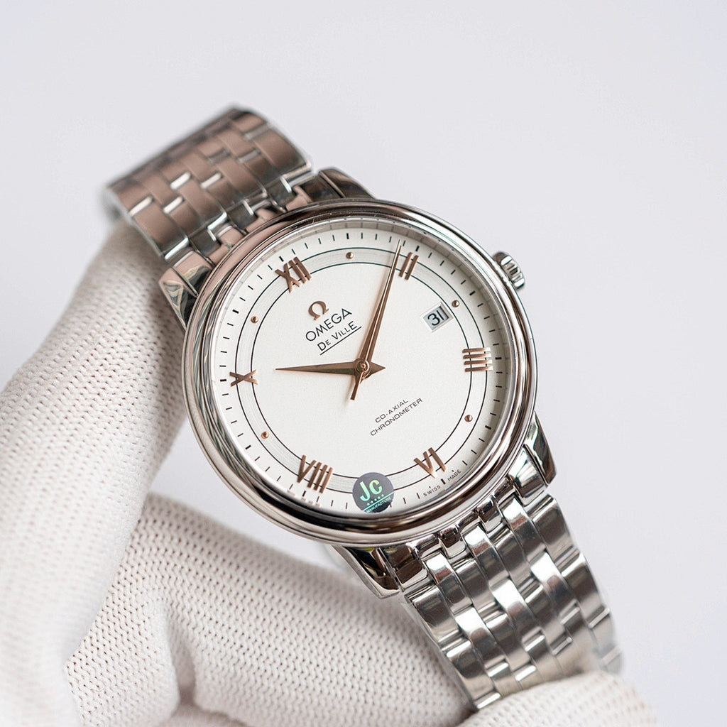 Omega De Ville wristwatch with steel bracelet, white dial, date at 31