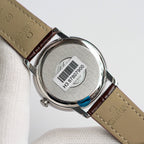 Omega De Ville caseback with brown leather strap, brushed metal back with serial numbers