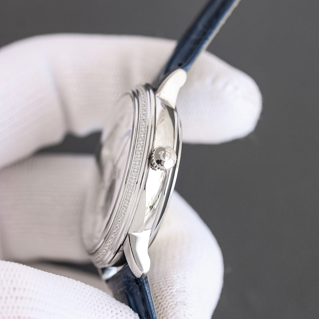 Omega watch side profile with silver-toned case and blue leather strap