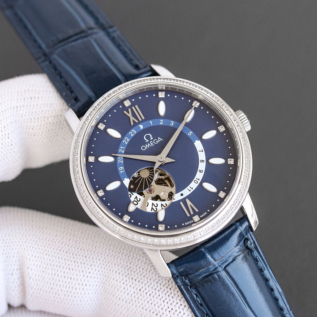 Omega watch with silver case, dark blue dial, blue leather strap, Roman numeral markers