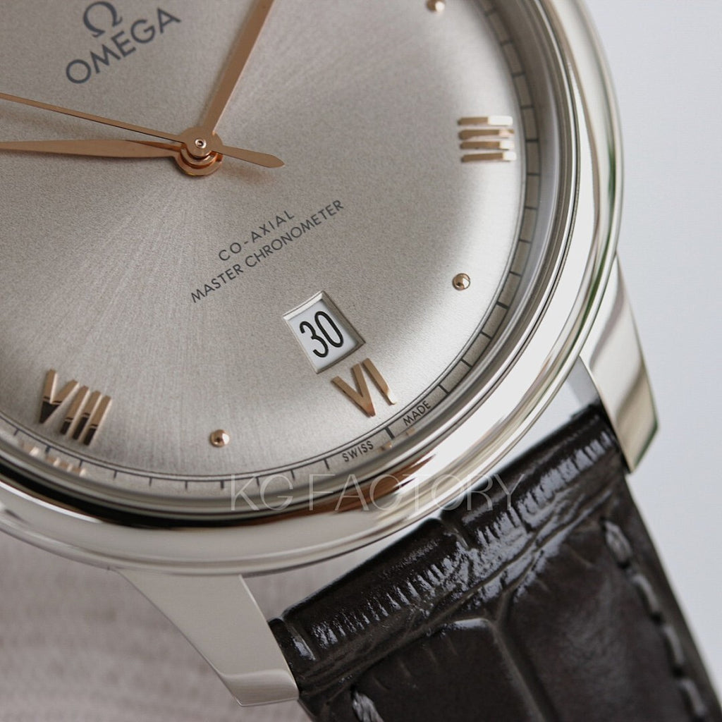 Omega watch close-up with champagne dial, gold hands, and black leather strap