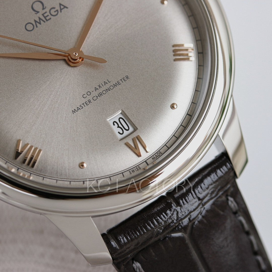 Omega watch close-up with champagne dial, gold hands, and black leather strap