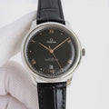 Omega dress watch with black dial, black leather strap, and stainless steel case
