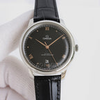 Omega dress watch with black dial, black leather strap, and stainless steel case