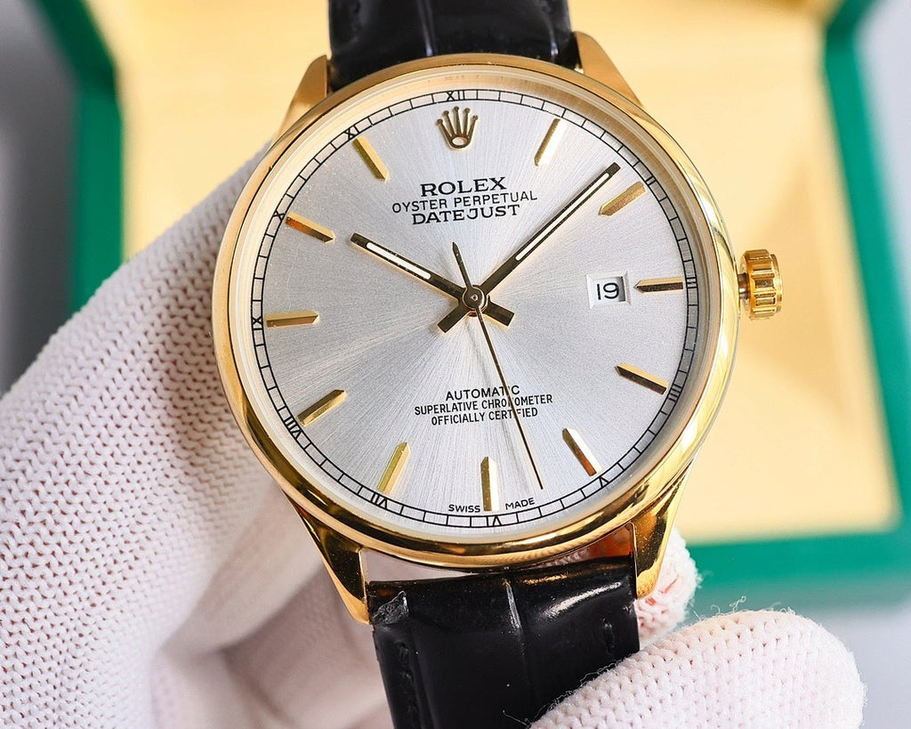 Omega wristwatch with black leather strap and silver dial, gold-tone bezel and baton markers