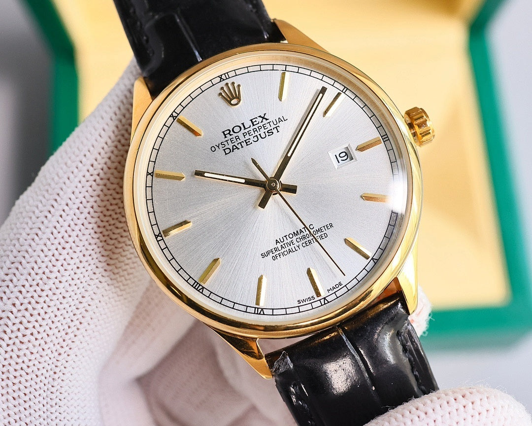 Omega wristwatch front view with black leather strap, silver dial, gold-tone bezel and date window
