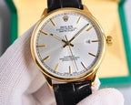 Omega wristwatch with black leather strap, silver dial, gold-tone bezel and date window