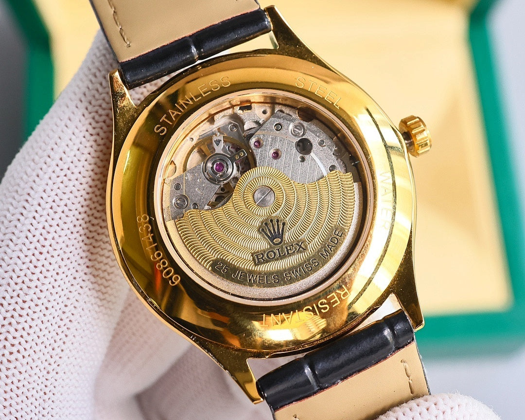 Omega wristwatch caseback with gold-tone metal and visible mechanical movement under clear cover