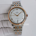 Omega wristwatch with white dial, gold bezel accents, and silver link bracelet