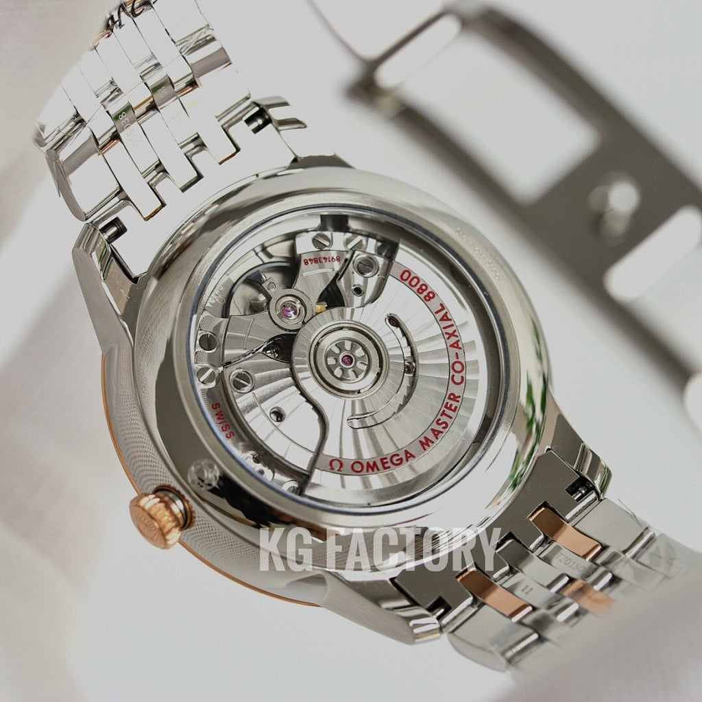 Omega wristwatch open back showing mechanical movement inside stainless case