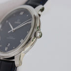 Omega wristwatch side profile with crown and black leather strap.