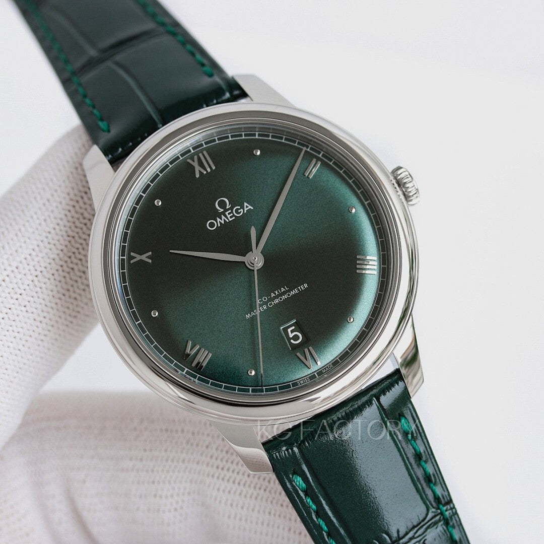 Omega wristwatch: green dial, silver case, green leather strap with stitching.