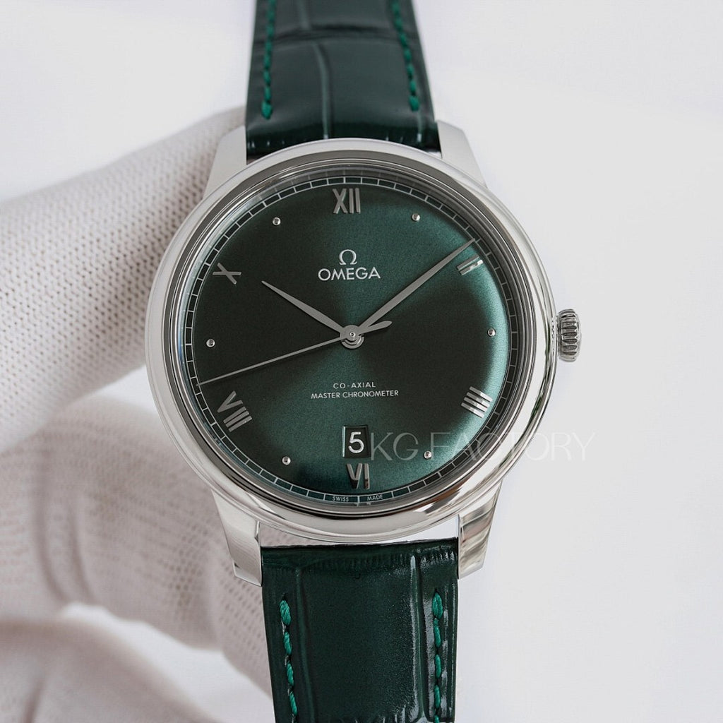 Omega wristwatch: green dial, silver case, green leather strap.