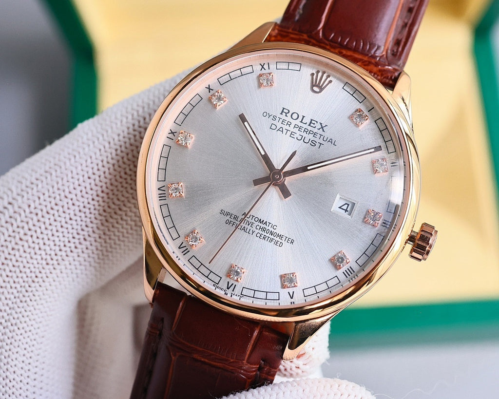Omega rose-gold wristwatch with silver dial and brown leather strap, close angle.