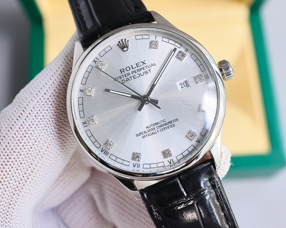 Round Omega wristwatch with silver dial, black leather strap, polished metal bezel.