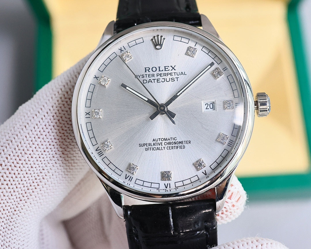 Omega round wristwatch with silver dial, black leather strap, polished metal bezel.