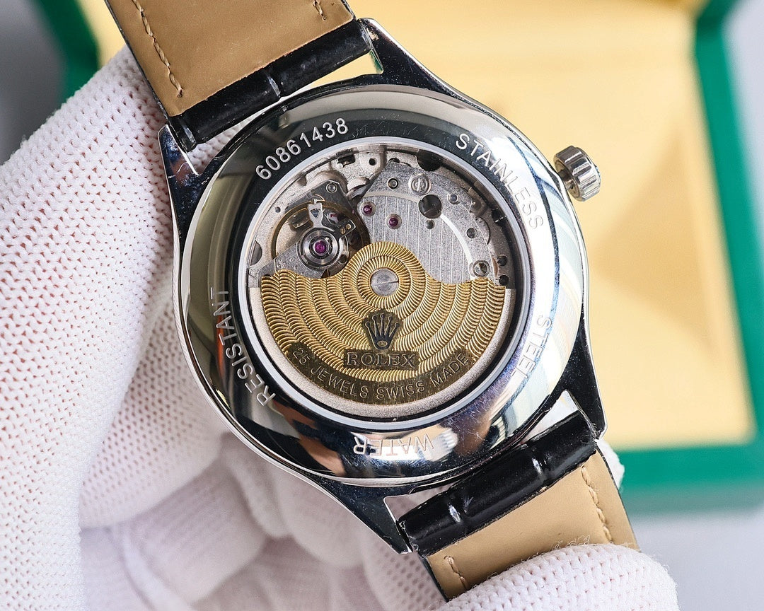 Omega wristwatch caseback view with exposed movement, black and tan leather strap.